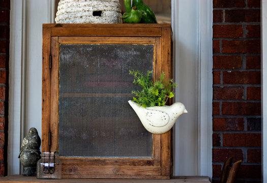 Pie Safe on Porch with Bird Decor