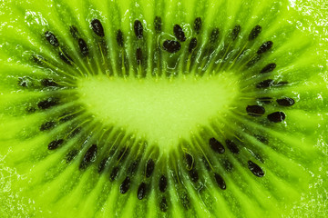 Slice of kiwi fruit background