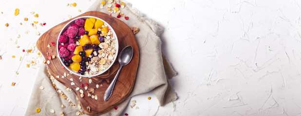 Raspberries, Mango and blueberries in a Bowl. Healthy breakfast concept with yoghurt