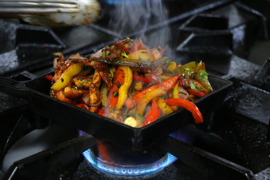 mexican fajitas on sizzling plate