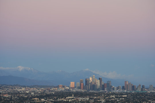 Los Angeles Skyline At Dusk With Mount San Antonio In The Background.