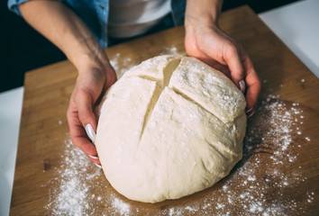Woman kneading dough