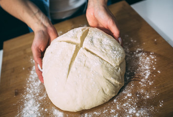 Woman kneading dough