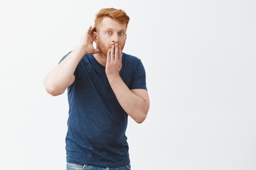 Tell me all details of rumor, listening carefully. Shocked impressed handsome redhead guy in blue...
