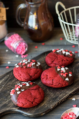 Cookies red velvet in chocolate glaze with the decor of sugar hearts