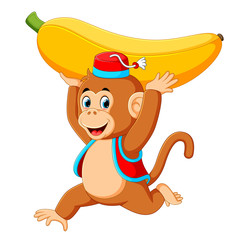 the circus monkey playing and holding up the big yellow banana