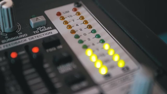 LED Indicator Level Signal on the Sound Mixing Console. Led light output level indicator. Close-up. The volume level changes with green, yellow and red indicator lights. Peak level, volume meters of