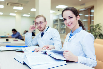 Obraz premium doctoral dissertation. background a medical student for textbooks in nursing school.