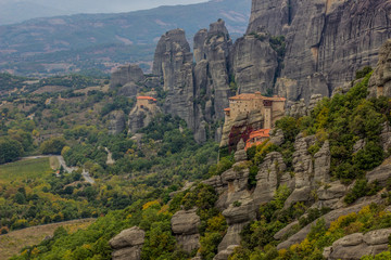 Fototapeta na wymiar christian monastery on mountain rock picturesque nature environment scenery landscape far from civilization