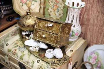 Old wooden carved casket with small boxes on vintage background