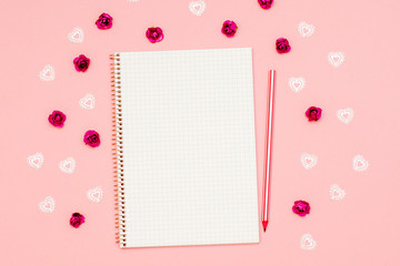 a notebook to record a message for Valentine's day. copy space. pencil, kiss