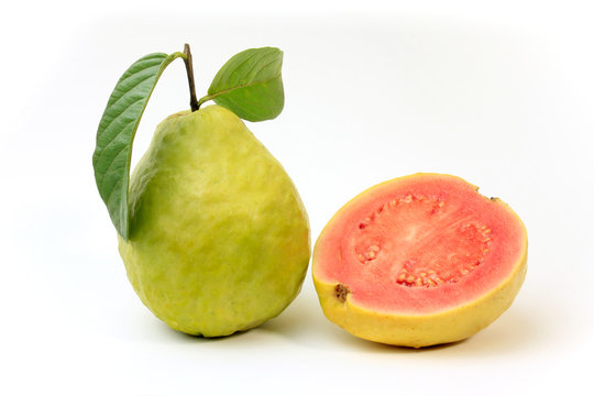 close-up guava fruit, pink, fresh, organic, with leaves, whole and sliced, isolated on white background