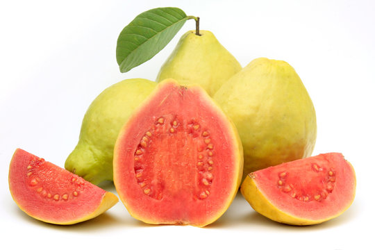 close-up guava fruit, pink, fresh, organic, with leaves, whole and sliced, isolated on white background