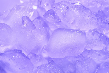 Many melting ice cubes on color background