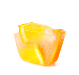 Ice cube with orange slices on white background