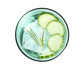 Glass of fresh cucumber water on white background, top view