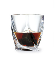 Glass of scotch whiskey on white background
