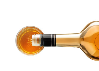 Pouring expensive whiskey into glass on white background, top view