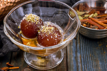 the Gulab jamun indian food on wooden background