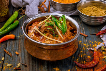 chicken tikka masala Indian food on wooden background with spices - obrazy, fototapety, plakaty