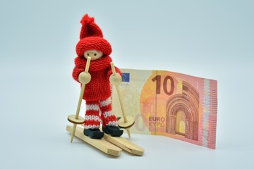 Esquiadora y billete de euros