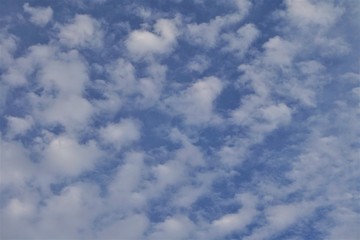 Amazing cumulus clouds on the background of blue sky, Georgia USA.