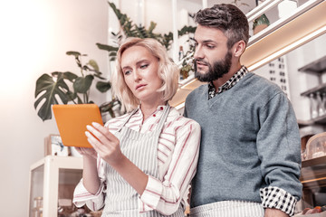 Nice young people looking at the tablet screen