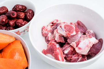 Preparing soup ingredients / pig bones