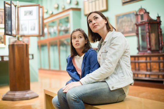 Mother and daughter enjoying medieval expositions