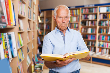 man reading new books