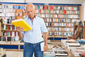 man reading new books