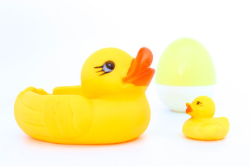 duck with mom on white background . Yellow plastic duck. Toy in baby bathroom.