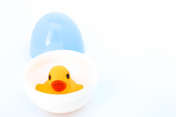 duck with mom on white background . Yellow plastic duck. Toy in baby bathroom.
