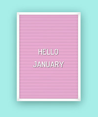 Hello January motivation quote on pink letterboard with white plastic letters