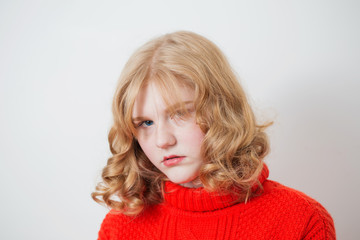 teen girl in red sweater on white background