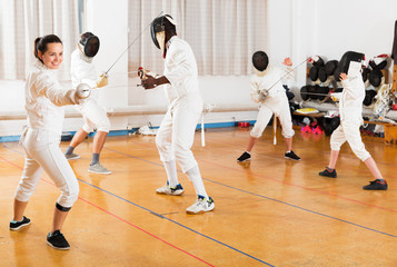 Woman training fencing movements