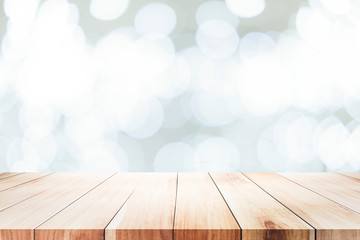 Wooden table with bokeh abstract background.