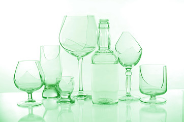 Broken wine glasses on a light background
