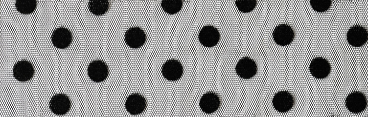 Closeup of black polka dot tulle texture
