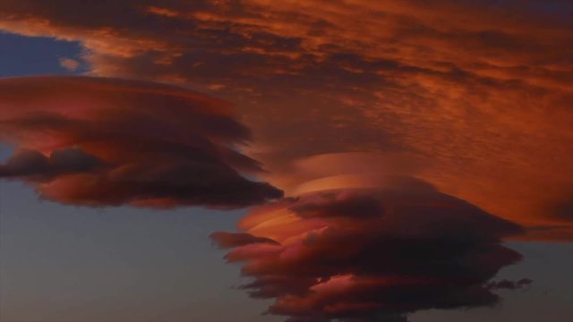 Time lapse of lenticular clouds at sunset