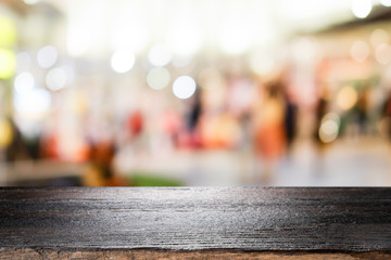 Wooden table with bokeh abstract background.
