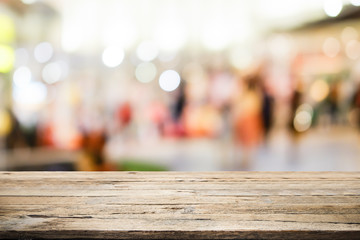 Wooden table with bokeh abstract background.