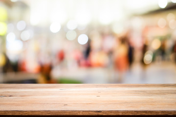 Wooden table with bokeh abstract background.