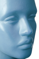 Male plastic mannequin. Face. Close-up. On a white background