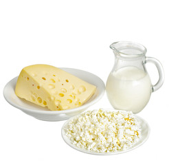 A jug of milk, cottage cheese, cheese. Isolated on white