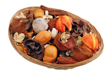Fragrant dried tropical nuts and fruits in a basket isolated