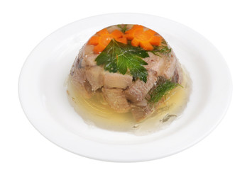 Homemade meat jelly from beef tongue with vegetables on a  plate isolated