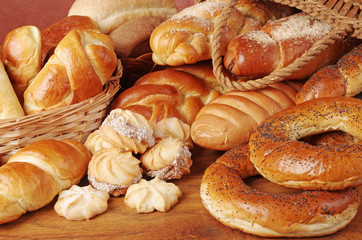 Bakery products. Loaves, rolls, loaves of bread on a wooden table