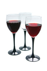 Two glasses of red wine and one empty glass. Isolated on white.