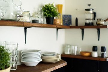 Dish on open shelves in kitchen